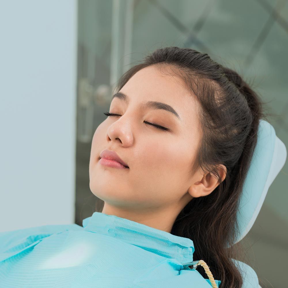 Woman relaxing in dentist's chair